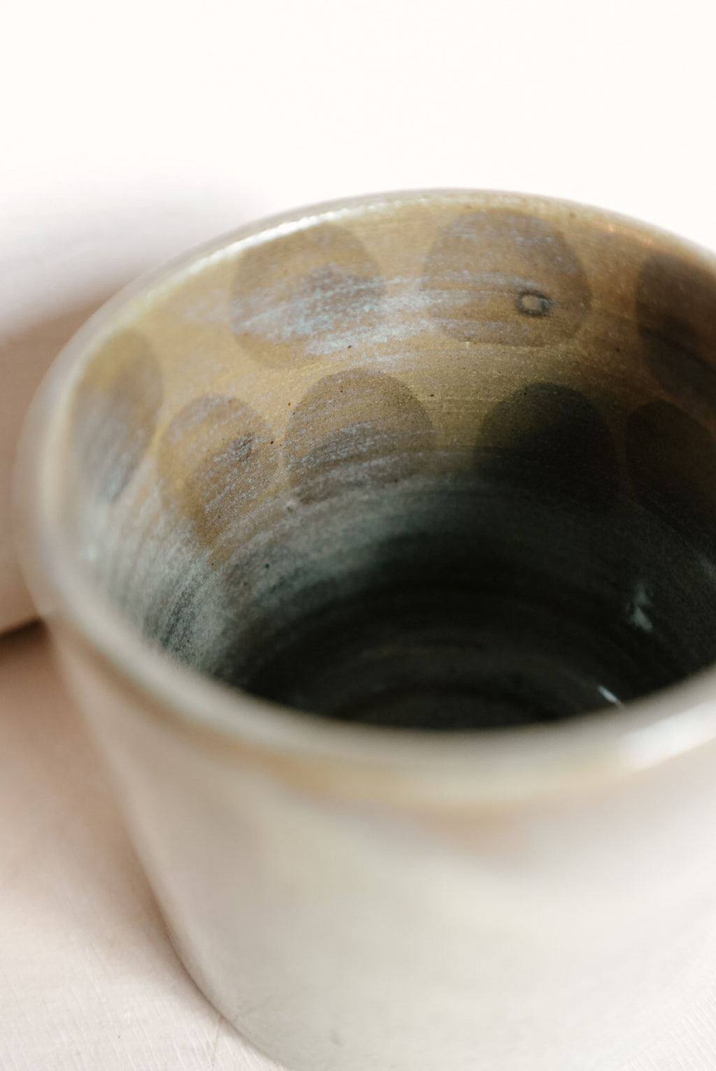 RABA cup with dots inside
