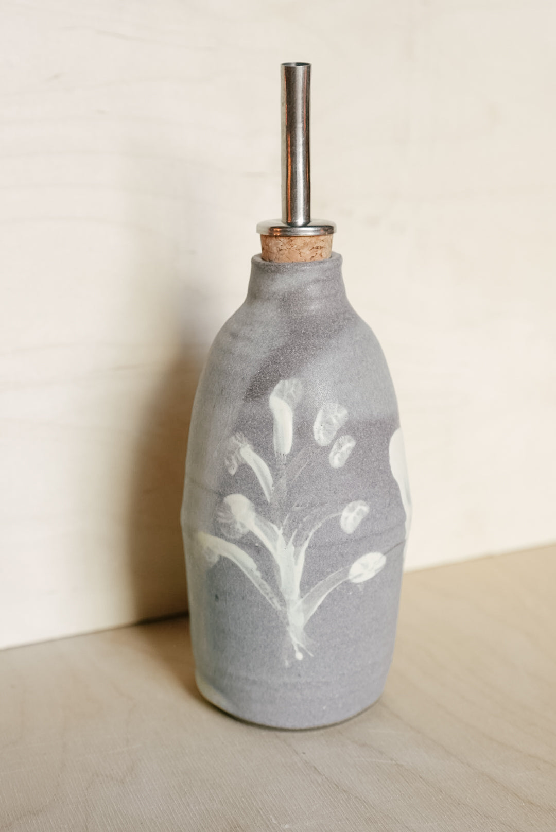 YO oil bottle with flowers