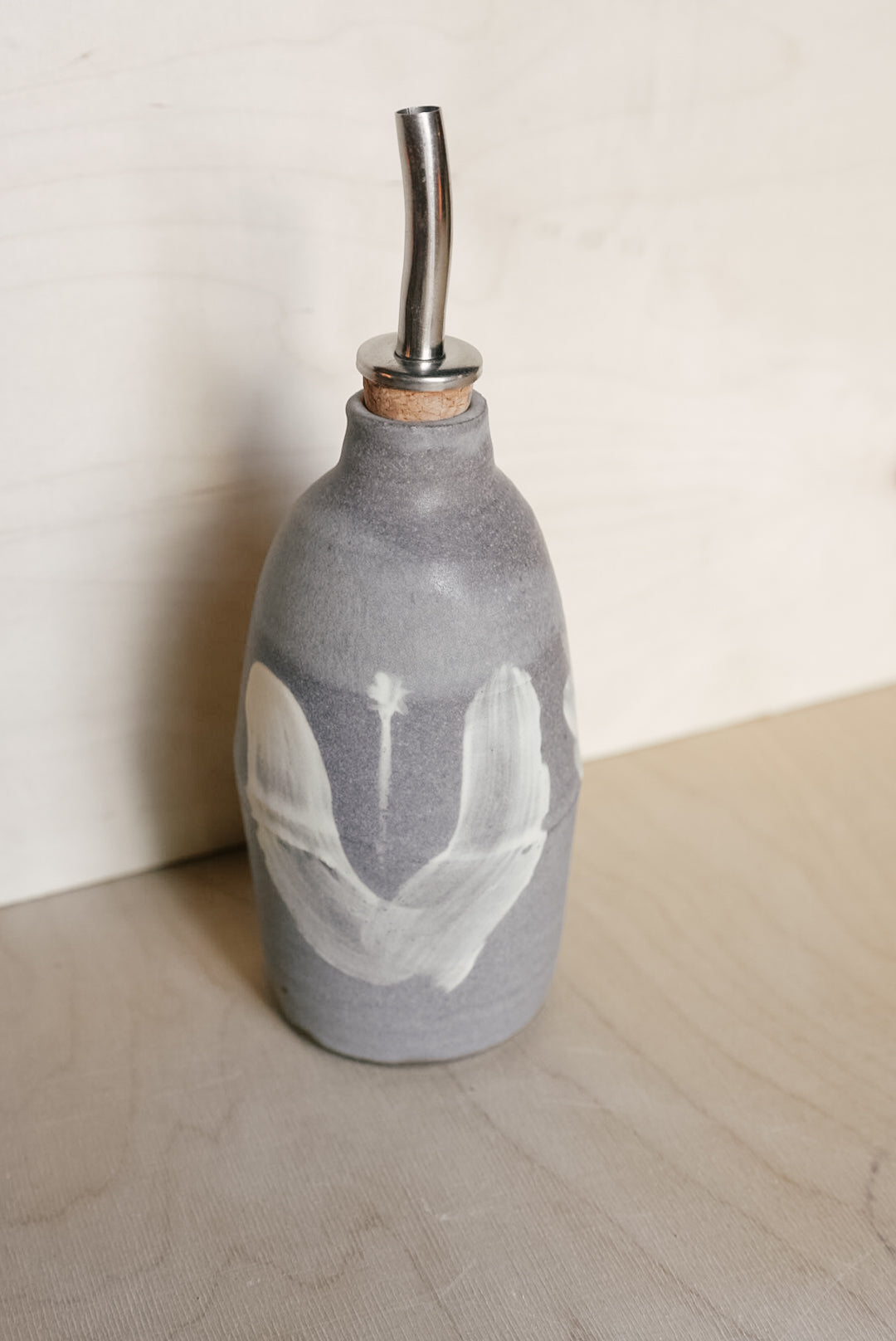 YO oil bottle with flowers
