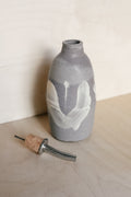 YO oil bottle with flowers