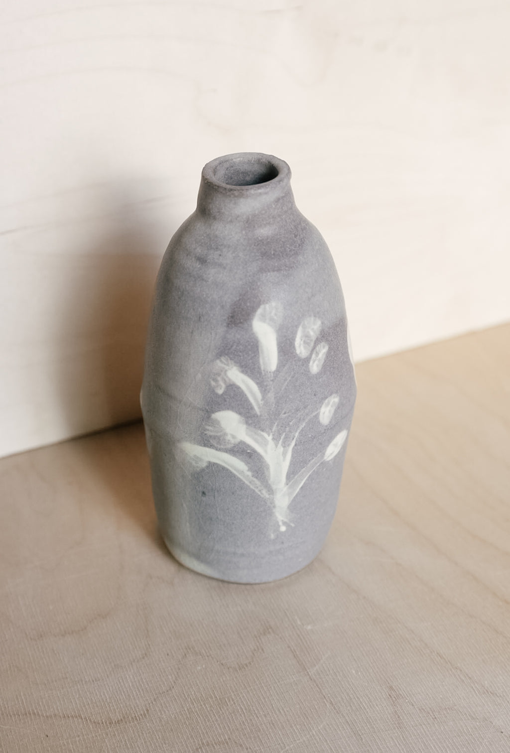 YO oil bottle with flowers